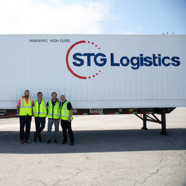 Four STG logistics team members.