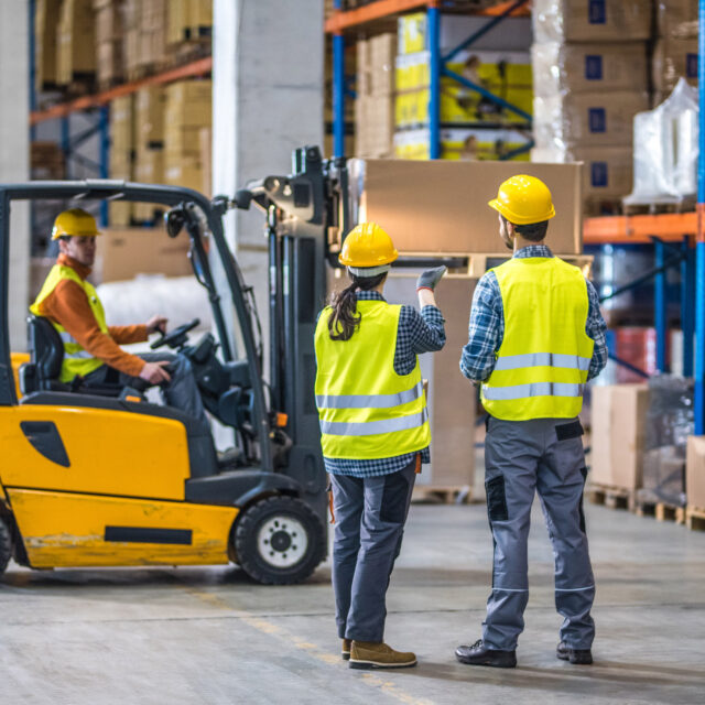 Two warehouse workers.